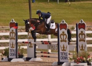 Dani Sussman- phto by Kathleen Bryan Woman on bay horse jumping